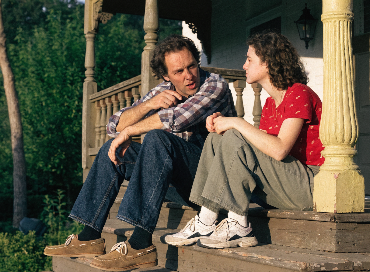 Father and daughter talking on the porch building confidence